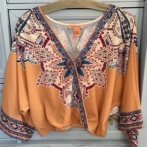 Medium flying tomato top. Had a button in front or wear open